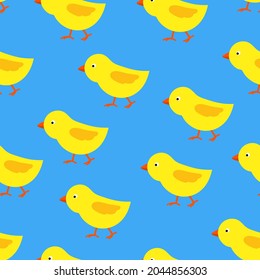Seamless pattern with chicks. Blue endless pattern with walking chick. Vector.