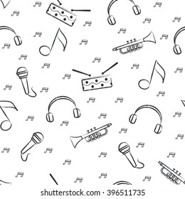 Seamless pattern children's black felt-tip pen drawings on white background. Hand-drawn style. Seamless vector wallpaper with the image of music instrument drum, microphone, pipe, headphones and note