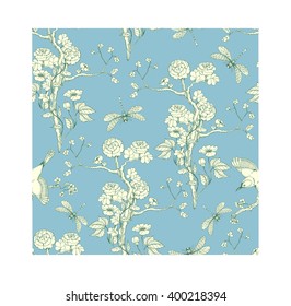 Seamless pattern in the chinoiserie style with peonies, dragonfly and bird on blue background for wedding, scrapbooking, wallpaper and other design.