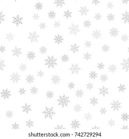 Seamless pattern. Christmas abstract background made of snowflakes on white. Design postcards, posters, greeting for the new year. Vector illustration.