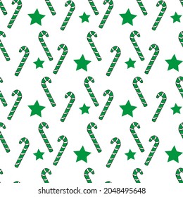 Seamless pattern with christmas candies and green stars on white background. Vector image.
