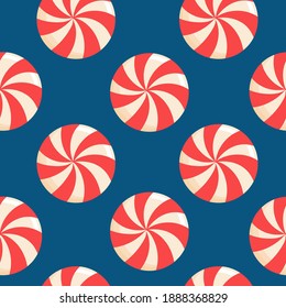 Seamless pattern with christmas candies on blue background