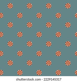 Seamless pattern of Christmas candies on blue background