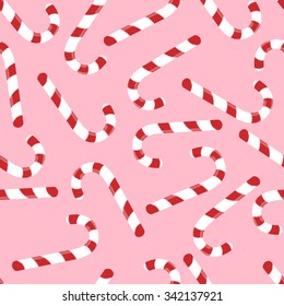 Seamless pattern with christmas candies on pink background. For use in the packaging paper, backgrounds, tablecloths. Vector illustration. 