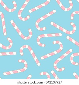 Seamless pattern with christmas candies on blue background. For use in the packaging paper, backgrounds, tablecloths. Vector illustration. 