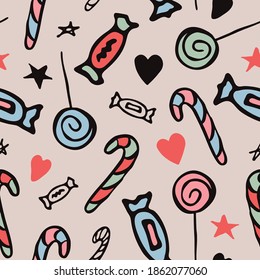 Seamless pattern with Christmas candies, sweets, hearts, stars. On a light pink background. In a cartoon style. Hand drawn. For festive designs, prints, fabric printing, wallpaper. Vector.