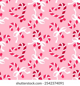 Seamless pattern with Christmas candy canes and bows on pink background. Romantic background design for fabric, wrapping paper, textile, wallpaper