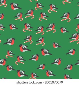 Seamless pattern for Christmas with cane lollipop and bullfinch bird. Winter holiday, cooking, new year's eve.