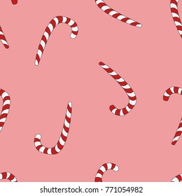 Seamless pattern of Christmas canes on a pink background
