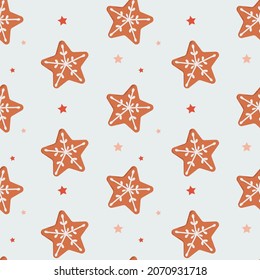 Seamless pattern of Christmas cookies in the form of stars on a light blue background. Bakery. Festive repeating textures for surface designs, wrapping paper, fabrics, textile. Vector illustration.