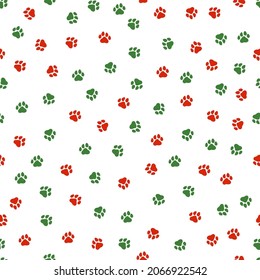 Seamless pattern with Christmas decoration. Green and red paws pattern.