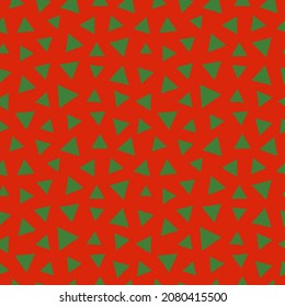 Patrón sin foco con decoración navideña. Triángulos verdes sobre fondo rojo.