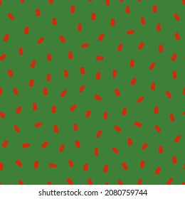 Seamless pattern with Christmas decoration. Red sprinkle on green background.