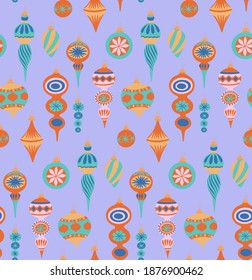 Seamless pattern with Christmas decorations repeating design on purple background. Surface design for textile, fabric, wallpaper, wrapping, giftwrap, paper, scrapbook and packaging. 