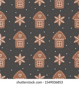 Seamless pattern with Christmas gingerbread cookies. Christmas house and snowflake.