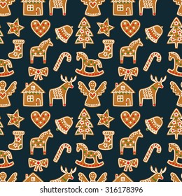 Seamless pattern with Christmas gingerbread cookies - xmas tree, candy cane, angel, bell, sock, gingerbread men, star, heart, deer, rocking horse. Winter holiday vector design xmas background.