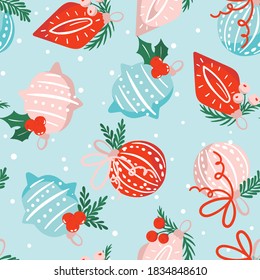 Seamless pattern with christmas hand-drawn ornaments decorated with holy leaves and pine branches in red, blue, white  colors