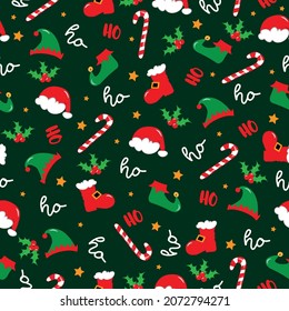 Seamless pattern for Christmas - Ho Ho Ho saying with mistletoe, Santa hat, and boots, Elf hat and shoes, candy cane on green backgound. 