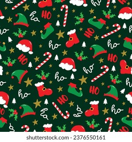 Seamless pattern for Christmas - Ho Ho Ho saying with mistletoe, Santa hat, and boots, Elf hat and shoes, candy cane on green backgound. 