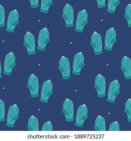 Seamless pattern with christmas mittens on blue background