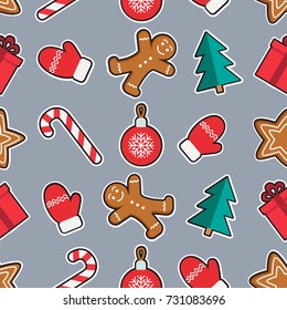 Seamless pattern of Christmas and New Year symbols. Gingerbread man, candy, gift, ball christmas tree, gloves pattern on gray background. Vector illustration.