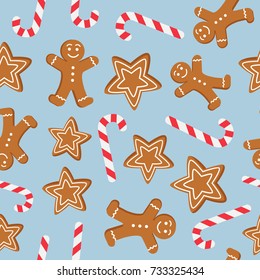 Seamless pattern of Christmas and New Year symbols. Gingerbread man, candy, 
 cookies pattern on blue background. Vector illustration