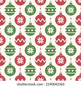 Seamless pattern with Christmas ornaments. Red and green ornaments on white background.