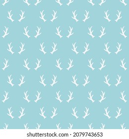 Seamless pattern with christmas reindeer horns decoration on blue background. Vector illustration