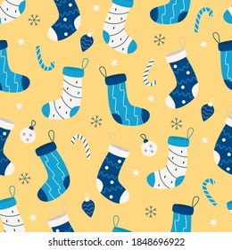 Seamless pattern of Christmas socks for gift, Christmas tree candies and toys. Vector illustration.