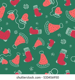 Seamless pattern with christmas socks, mittens and hats. Vector illustration.