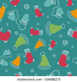 Seamless pattern with christmas socks, mittens and hats. Vector illustration.