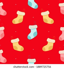 Seamless pattern with christmas socks on red background