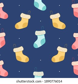 Seamless pattern with christmas socks on blue background