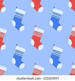 Seamless pattern with Christmas socks on blue background. Vector texture.