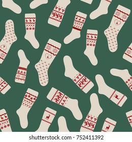 Seamless Pattern with Christmas socks on green