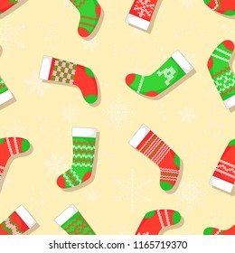 Seamless pattern with Christmas stockings. Vector background.