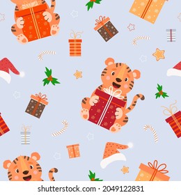 Seamless pattern with Christmas tiger. Cute animal with a big gift on a light blue background with Santa hat, mistletoe and gingerbread, gift boxes and striped caramel. Vector illustration