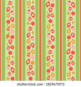 Seamless pattern of christmas tree toys on green striped background