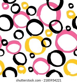 Seamless pattern, circles handmade with marker pen. 3 three colors, pink, yellow and black. Fun and light print for the summer, asymmetrical, organic shapes. Polka dots. Swimwear, backdrop design.