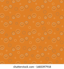 Seamless pattern of circles on a curry background.