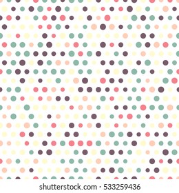 Seamless pattern of circles on a white background. Muted shades.