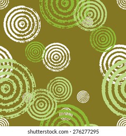 Seamless pattern of circles. A pattern of circles and rings. Radial shape retro style with grunge.Rapport from small parts. A blank for print tissue wrapping paper.
