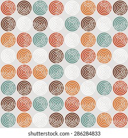 Seamless pattern of circles. A pattern of circles and rings. Radial shape retro style with grunge.Rapport from small parts. A blank for print tissue wrapping paper.Textile  ornament.