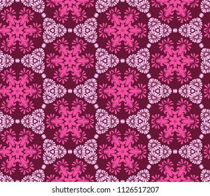 Seamless pattern from circular abstract floral ornaments in pink and crimson colors on a maroon background. Vector illustration. Suitable for fabric, wallpaper and wrapping paper