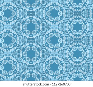 Seamless pattern from circular abstract floral ornaments in powder blue color on a deep sky blue background. Vector illustration. Suitable for fabric, wallpaper and wrapping paper