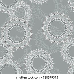 Seamless pattern with circular floral ornaments. Floral background with mandalas for the greeting cards, invitation, business style, cards, textile backgrounds or else. Vector illustration.
