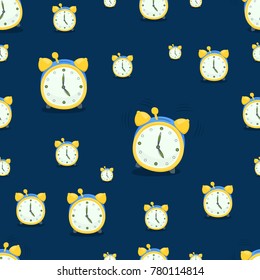 A seamless pattern of classic alarm clocks on a blue background. Cartoon vector background.