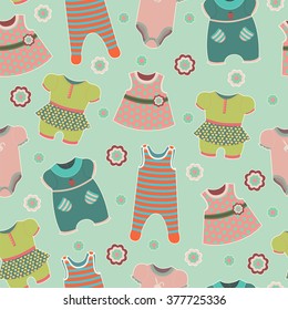 Seamless pattern with clothes for babies on a blue background. EPS10 vector illustration.