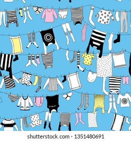 Seamless  pattern clothes on washing line on blue background, hand sketch
