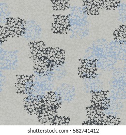Seamless pattern. Clouts with stars. Random order. Spotted chaos. Fashion camouflage. Grunge image.